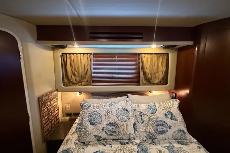 Slide: The Image of Luxurious bedroom interior of 2007 Sea Ray 40 Motor Yacht with cozy bedding and elegant decor. - 84