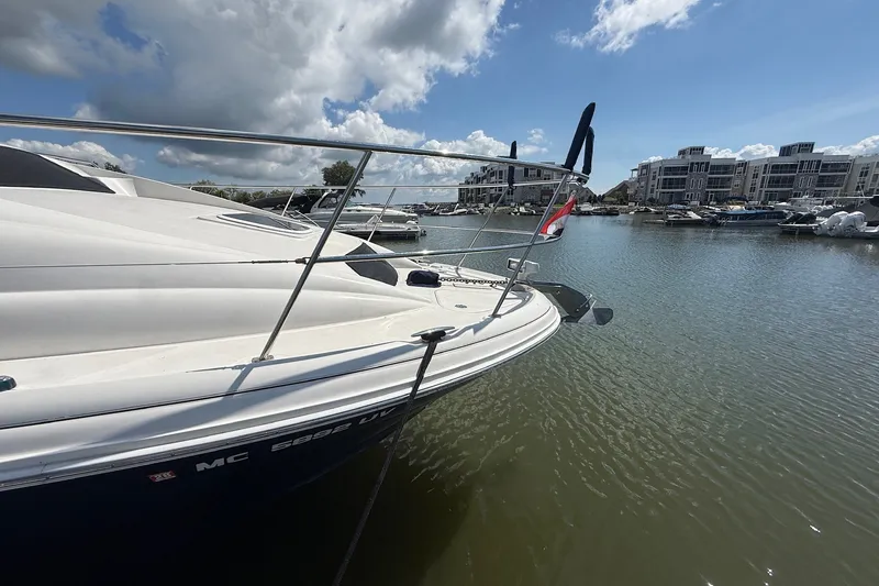 Slide: The Image of 2007 Sea Ray 40 Motor Yacht docked in a marina under a partly cloudy sky. - 12