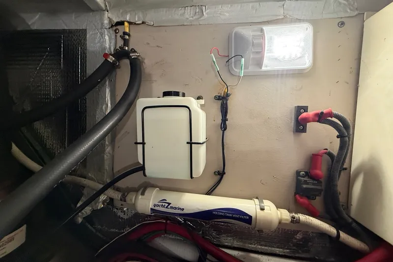 Slide: The Image of Engine room of 2007 Sea Ray 40 Motor Yacht with holding tank vent filter. - 106
