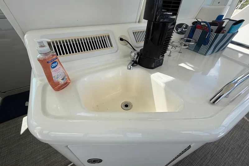 Slide: The Image of Sink area on a 2007 Sea Ray 40 Motor Yacht with soap and accessories. - 30