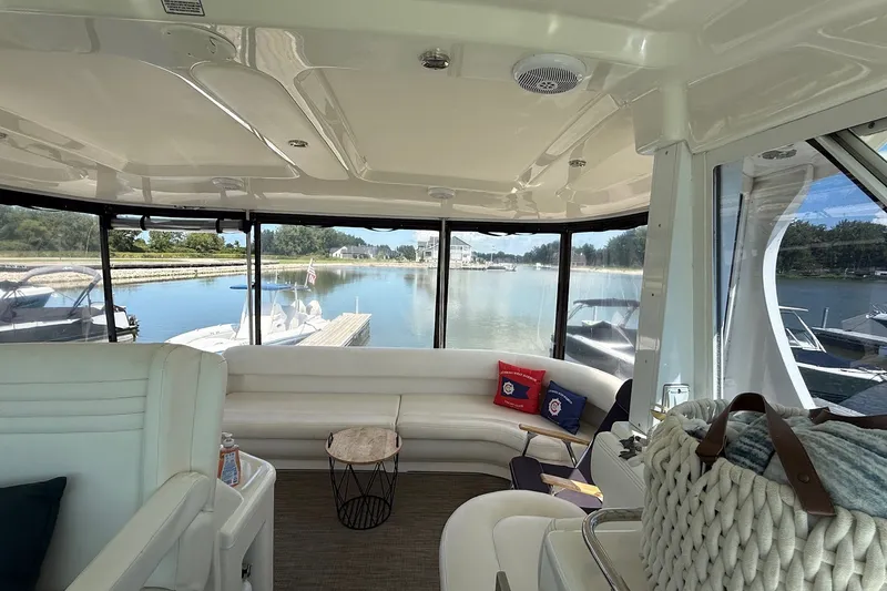 Slide: The Image of Luxurious interior of a 2007 Sea Ray 40 Motor Yacht with scenic marina view. - 52