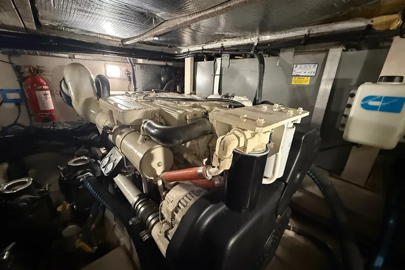 Slide: The Image of Engine room of a 2007 Sea Ray 40 Motor Yacht, showcasing detailed machinery. - 101