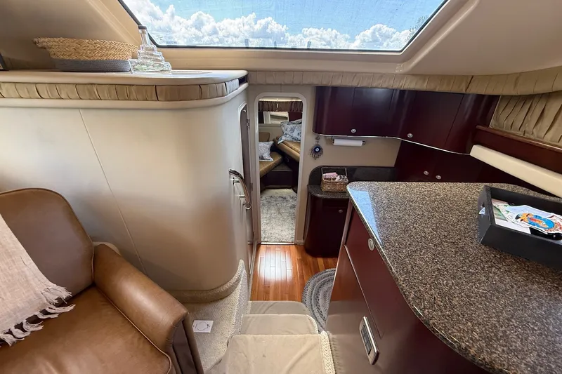 Slide: The Image of Luxurious interior of 2007 Sea Ray 40 Motor Yacht with elegant furnishings and skylight. - 63