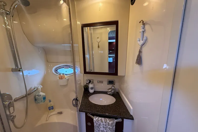 Slide: The Image of Luxurious bathroom in 2007 Sea Ray 40 Motor Yacht with modern fixtures and nautical decor. - 72