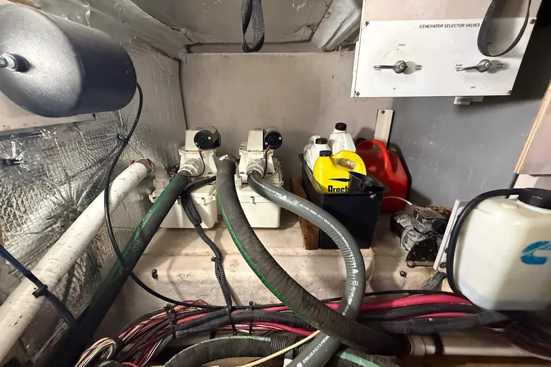 Slide: The Image of Engine room of 2007 Sea Ray 40 Motor Yacht with hoses and containers. - 110