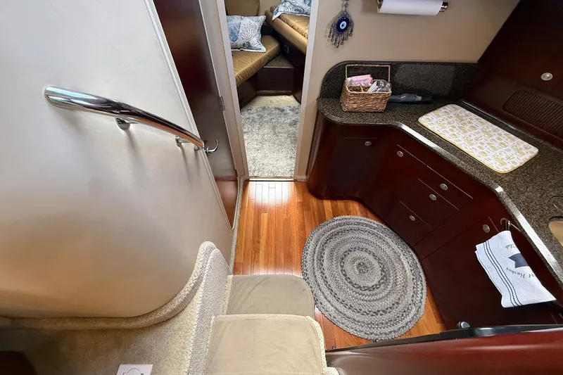 Slide: The Image of Interior of 2007 Sea Ray 40 Motor Yacht with wooden flooring and modern amenities. - 64