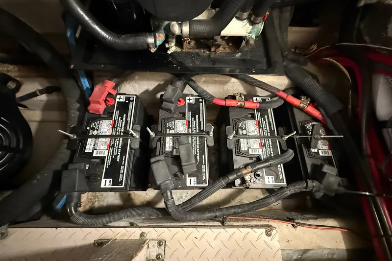 Slide: The Image of Battery compartment of a 2007 Sea Ray 40 Motor Yacht with three batteries connected. - 105