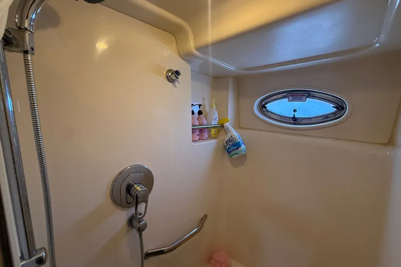 Slide: The Image of Shower area in 2007 Sea Ray 40 Motor Yacht with porthole and toiletries. - 95