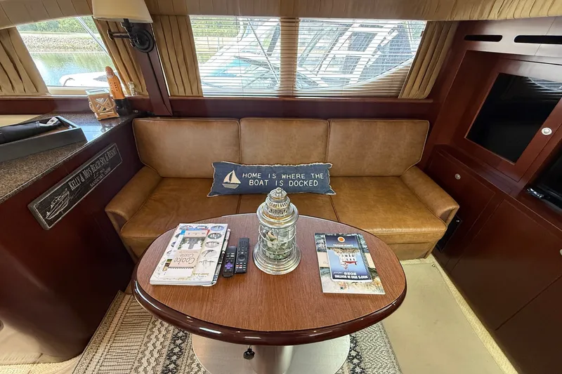 Slide: The Image of Luxurious 2007 Sea Ray 40 Motor Yacht interior with cozy seating and nautical decor. - 55