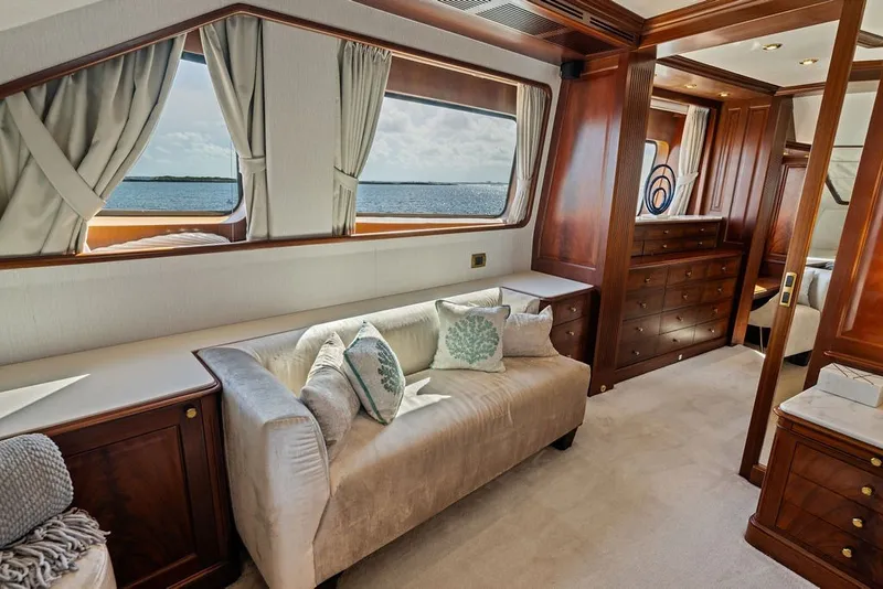 Slide: The Image of Luxurious interior of a 2007 Benetti 120 Classic yacht with elegant wood finishes and plush seating. - 94