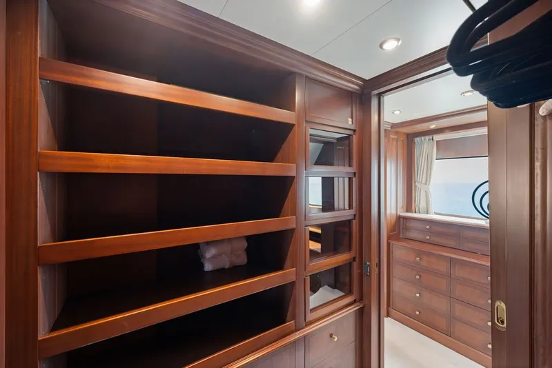 Slide: The Image of Luxurious wooden closet interior on a 2007 Benetti 120 Classic yacht. - 103
