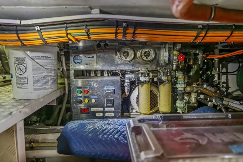 Slide: The Image of Engine room of a 2007 Benetti 120 Classic yacht, featuring control panels and machinery. - 161