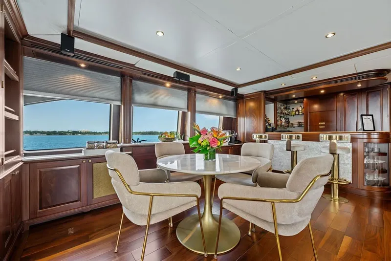 Slide: The Image of Luxurious interior of 2007 Benetti 120 Classic yacht with elegant dining area and bar. - 79