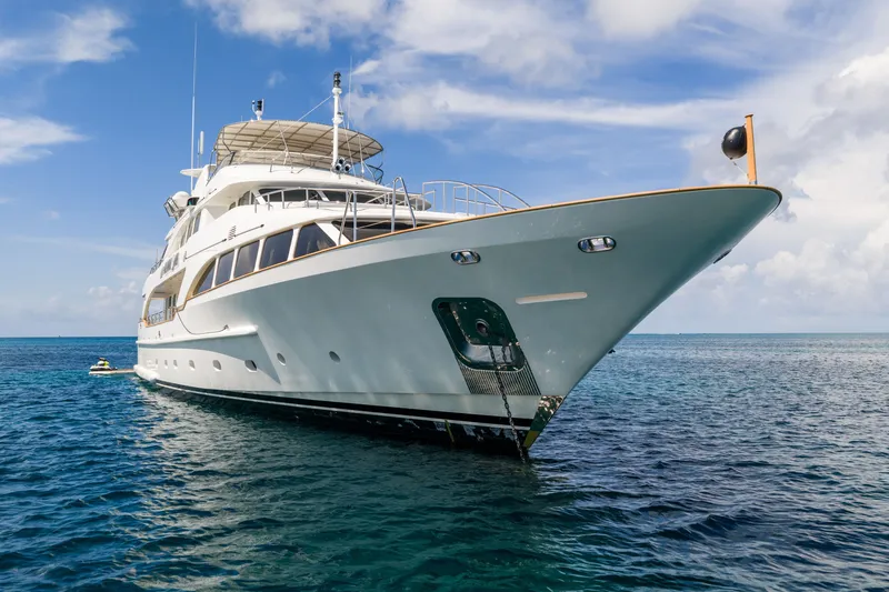 Slide: The Image of Luxury yacht Benetti 120 Classic 2007 on open sea under blue sky. - 4