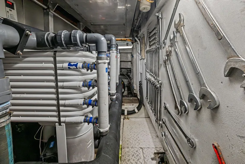 Slide: The Image of Engine room of a 2007 Benetti 120 Classic yacht with tools and piping system. - 163