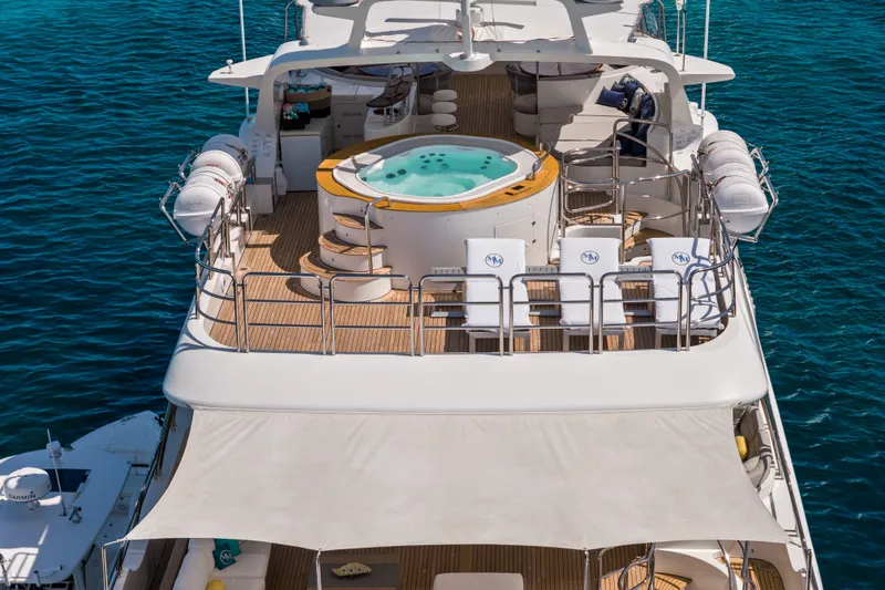 Slide: The Image of Luxurious 2007 Benetti 120 Classic yacht with jacuzzi on deck, surrounded by ocean. - 6