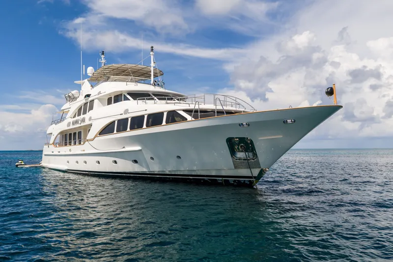 Slide: The Image of Luxury yacht Benetti 120 Classic 2007 on serene ocean waters under a blue sky. - 12
