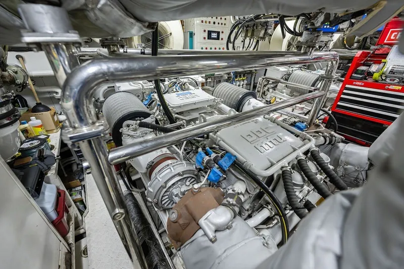 Slide: The Image of Engine room of a 2007 Benetti 120 Classic yacht, showcasing mechanical components and tools. - 153