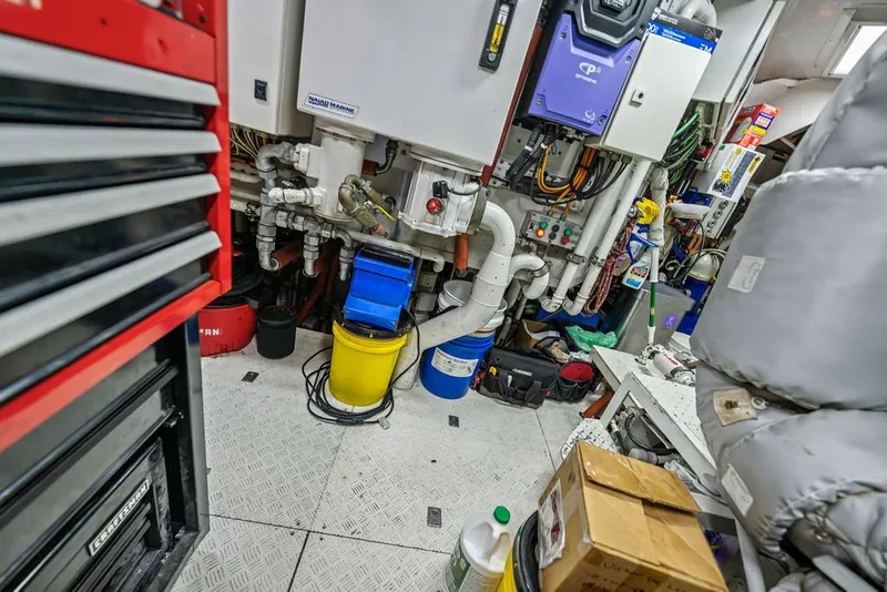 Slide: The Image of Engine room of a 2007 Benetti 120 Classic yacht with tools and equipment. - 158