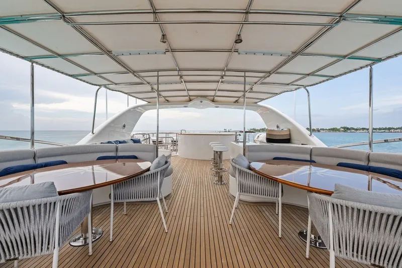 Slide: The Image of Luxurious 2007 Benetti 120 Classic yacht deck with elegant seating and ocean view. - 41