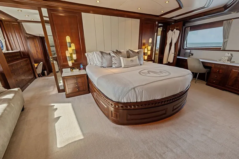 Slide: The Image of Luxurious bedroom interior on a 2007 Benetti 120 Classic yacht with elegant wood finishes. - 99