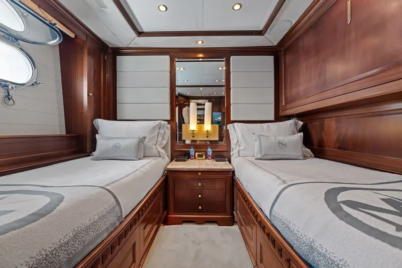 Slide: The Image of Luxurious twin cabin on 2007 Benetti 120 Classic yacht with elegant wood paneling. - 130