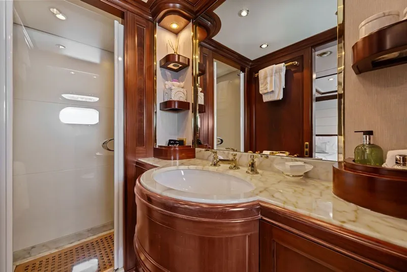 Slide: The Image of Luxurious bathroom on 2007 Benetti 120 Classic yacht with marble countertop and elegant wood finishes. - 133