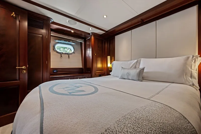 Slide: The Image of Luxurious bedroom interior on a 2007 Benetti 120 Classic yacht, featuring elegant wood finishes. - 117