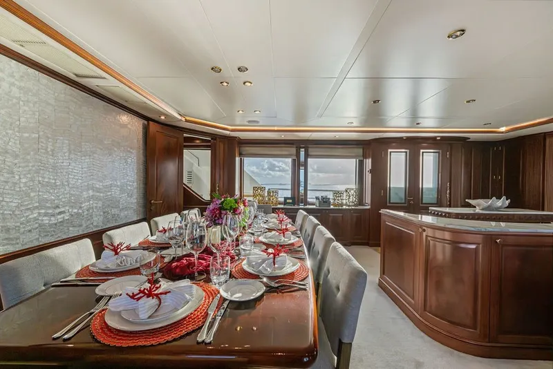 Slide: The Image of Luxurious dining area on a 2007 Benetti 120 Classic yacht, elegantly set table. - 150