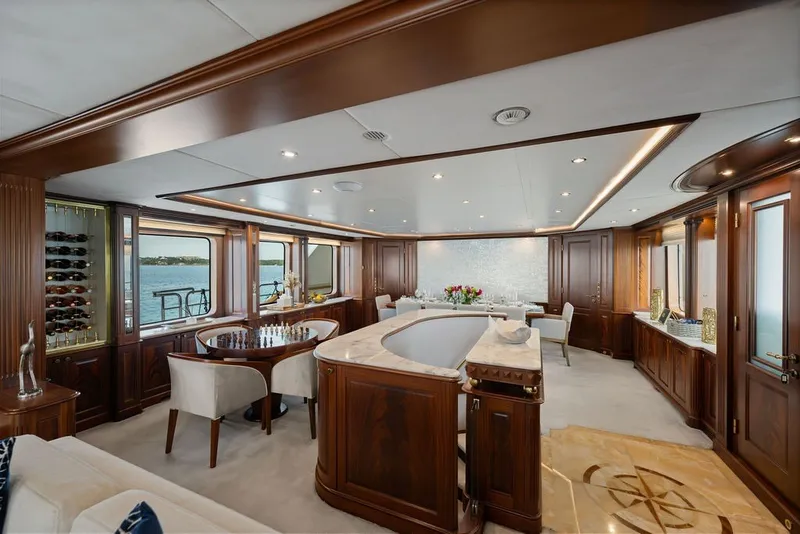 Slide: The Image of Luxurious interior of 2007 Benetti 120 Classic yacht with elegant wood finishes and panoramic windows. - 58