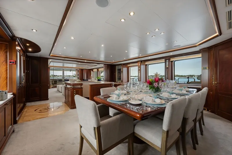 Slide: The Image of Luxurious dining area on a 2007 Benetti 120 Classic yacht, featuring elegant table settings. - 71