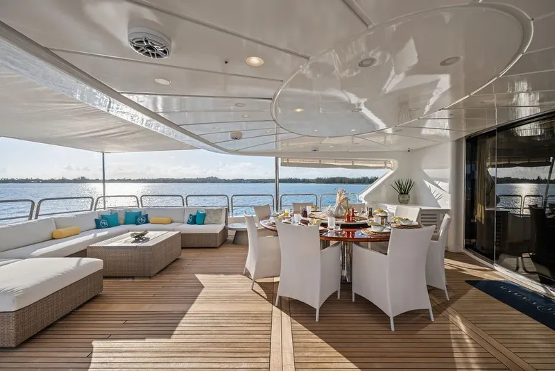 Slide: The Image of Luxurious outdoor dining area on a 2007 Benetti 120 Classic yacht, featuring elegant seating and ocean views. - 38