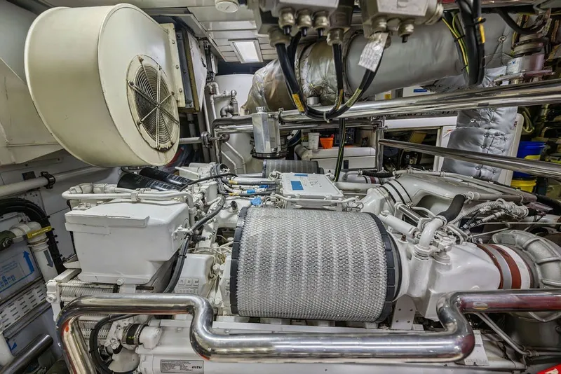 Slide: The Image of Engine room of a 2007 Benetti 120 Classic yacht, showcasing mechanical components. - 155