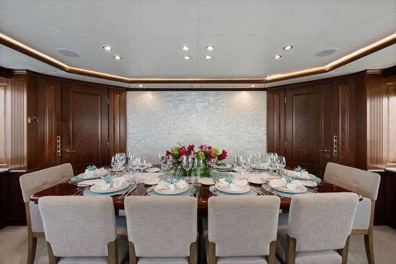Slide: The Image of Luxurious dining area on 2007 Benetti 120 Classic yacht, elegantly set table with floral centerpiece. - 73