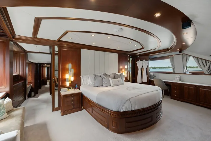 Slide: The Image of Luxurious bedroom interior on a 2007 Benetti 120 Classic yacht, featuring elegant wood finishes. - 96