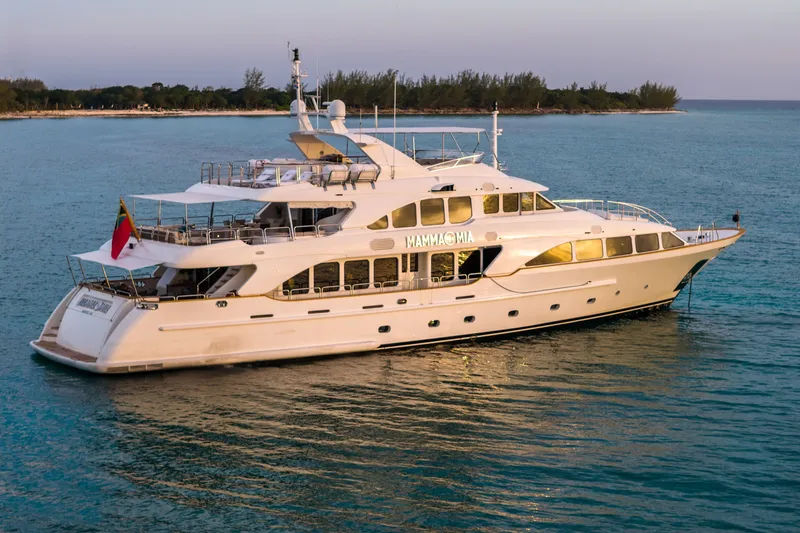 Slide: The Image of Luxury yacht Benetti 120 Classic 2007 on serene ocean waters at sunset. - 15