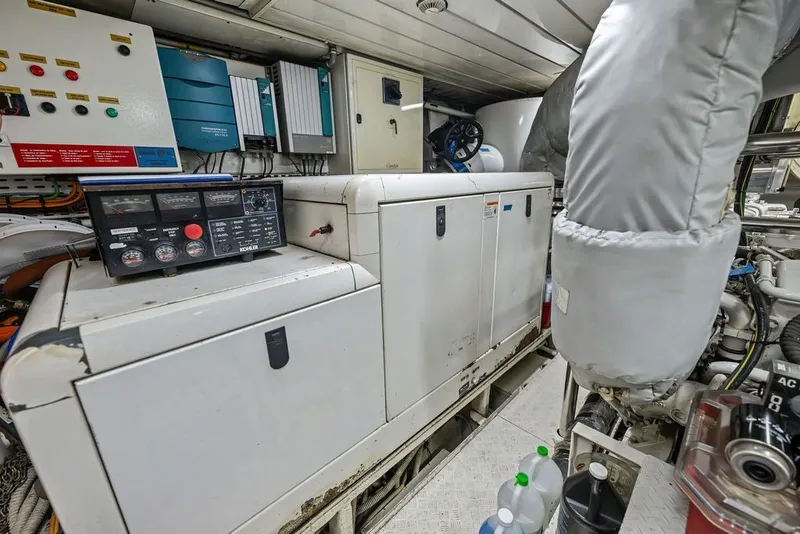 Slide: The Image of Engine room of a 2007 Benetti 120 Classic yacht with control panels and machinery. - 160