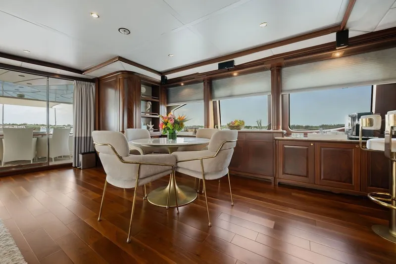 Slide: The Image of Luxurious interior of 2007 Benetti 120 Classic yacht with elegant dining area and wooden flooring. - 90