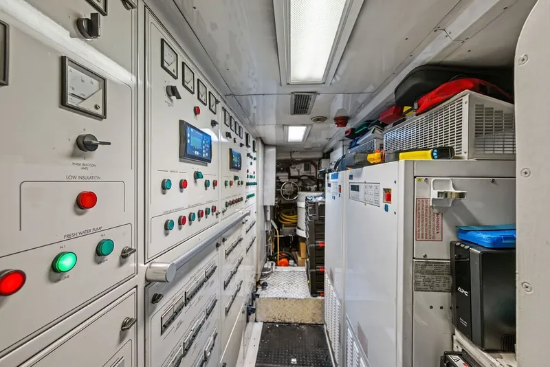 Slide: The Image of Engine room of 2007 Benetti 120 Classic yacht with control panels and equipment. - 166