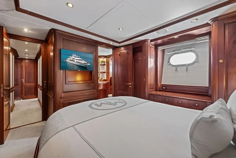 Slide: The Image of Luxurious bedroom interior of 2007 Benetti 120 Classic yacht with elegant wood paneling. - 123