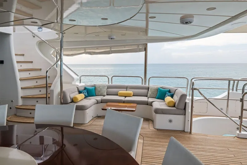 Slide: The Image of Luxurious 2007 Benetti 120 Classic yacht deck with elegant seating and ocean view. - 31