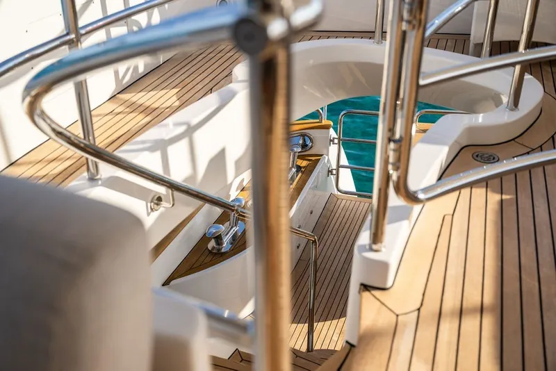 Slide: The Image of Luxurious teak deck of 2007 Benetti 120 Classic yacht with stainless steel railings. - 32