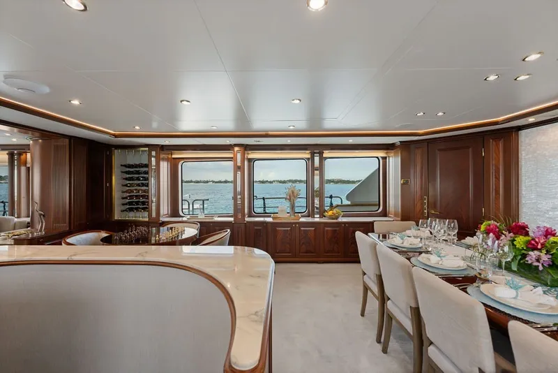 Slide: The Image of Luxurious dining area on a 2007 Benetti 120 Classic yacht with elegant decor and ocean views. - 64