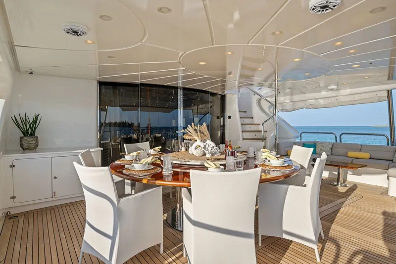 Slide: The Image of Luxurious dining area on a 2007 Benetti 120 Classic yacht with ocean view. - 35
