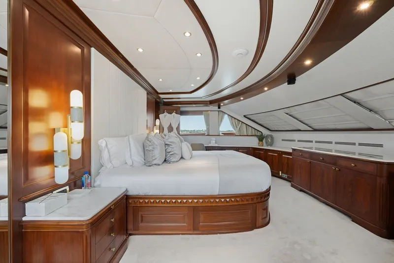 Slide: The Image of Luxurious bedroom interior on a 2007 Benetti 120 Classic yacht, featuring elegant wood finishes. - 95