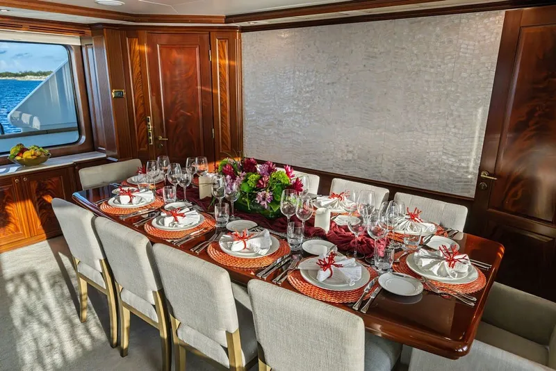 Slide: The Image of Luxurious dining area on a 2007 Benetti 120 Classic yacht, elegantly set table with ocean view. - 149