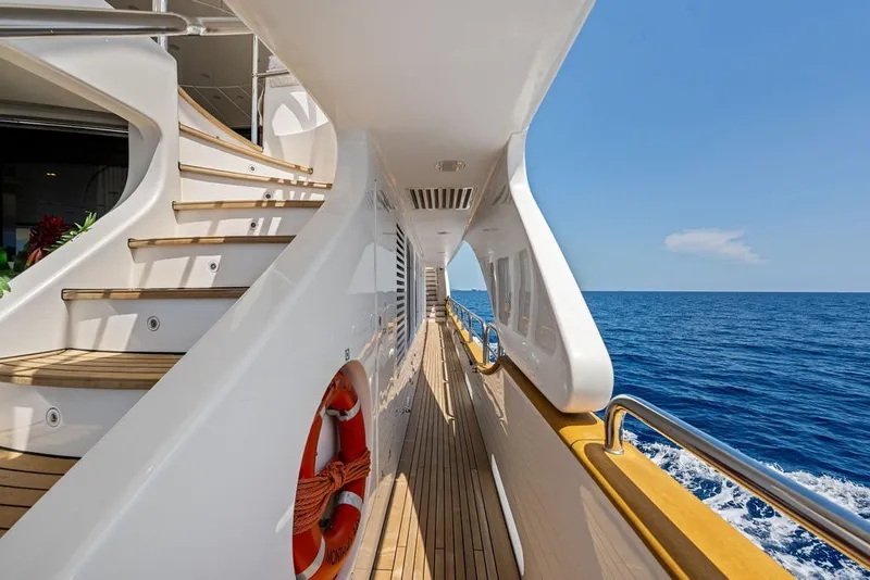 Slide: The Image of Side deck view of 2007 Benetti 120 Classic yacht cruising on open sea. - 27