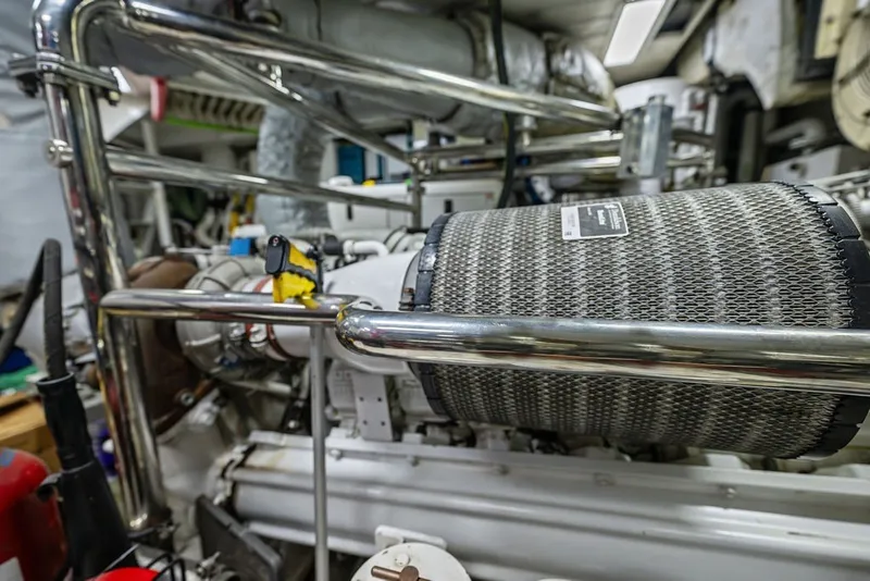 Slide: The Image of Engine room of a 2007 Benetti 120 Classic yacht, featuring polished metal components. - 157