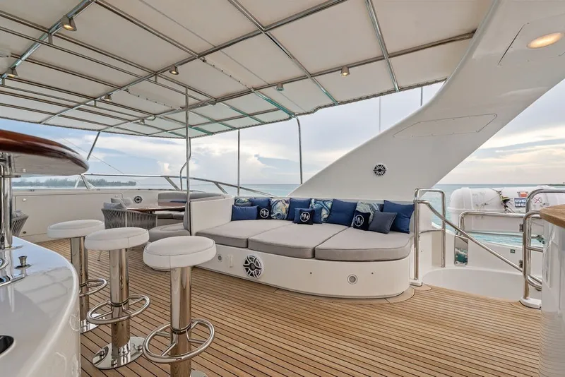 Slide: The Image of Luxurious deck of 2007 Benetti 120 Classic yacht with seating and bar stools. - 47
