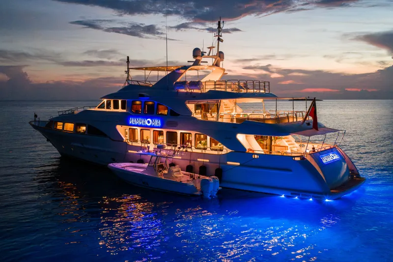 Slide: The Image of Luxurious 2007 Benetti 120 Classic yacht illuminated at sunset on tranquil waters. - 18